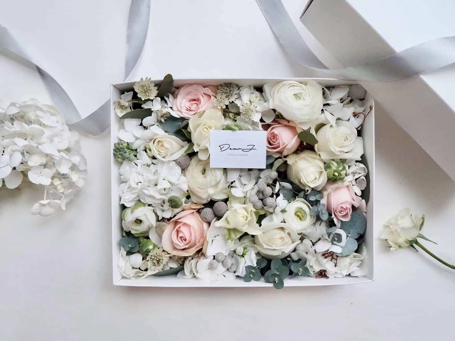 White and Avalanche Pink Roses, Ranunculus, Astrantia, Silver Brunia Ball, Hydrangea and Eucalyptus Gunni.